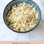 cooked quinoa in blue bowl graphic for pinterest