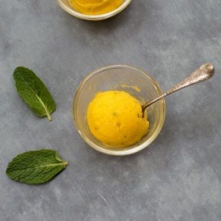 Thermomix Mango Sorbet - a refreshing sorbet that tastes like a Mojito but without the rum! Made with mangoes, mint, lime and a little honey, it's ready in minutes.