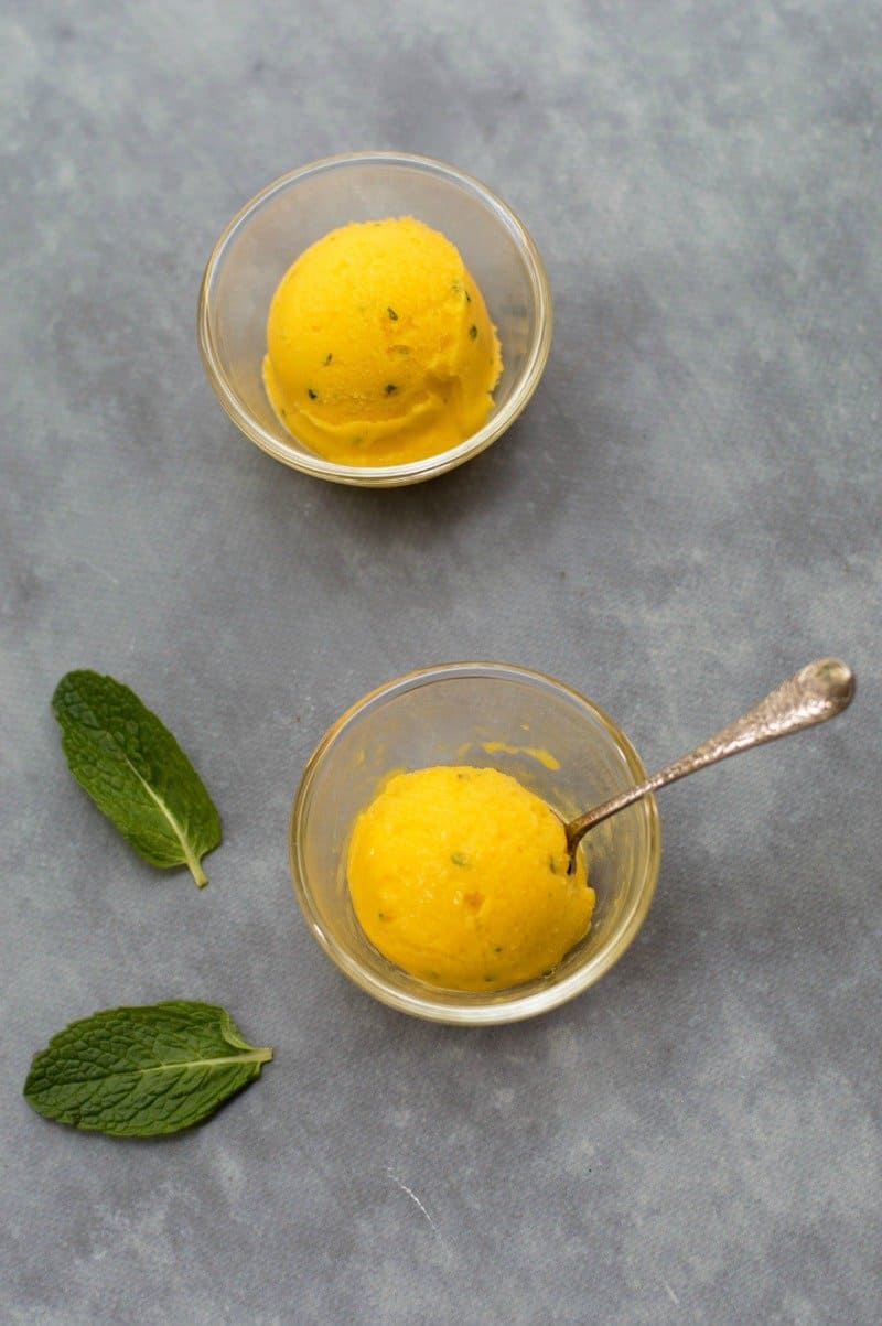 Thermomix Mango Sorbet - a refreshing sorbet that tastes like a Mojito but without the rum! Made with mangoes, mint, lime and a little honey, it's ready in minutes.