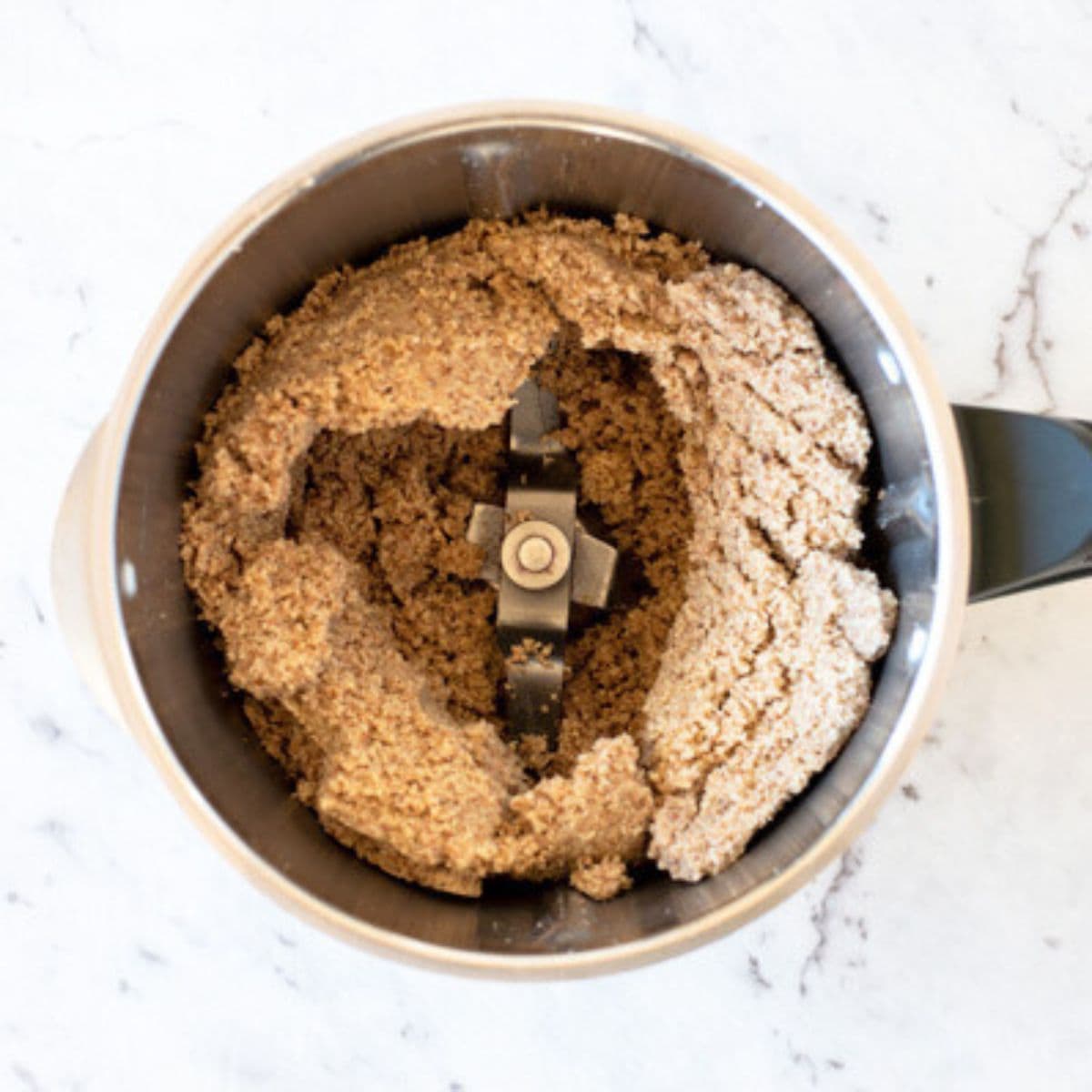 Ground almonds in a Thermomix bowl.