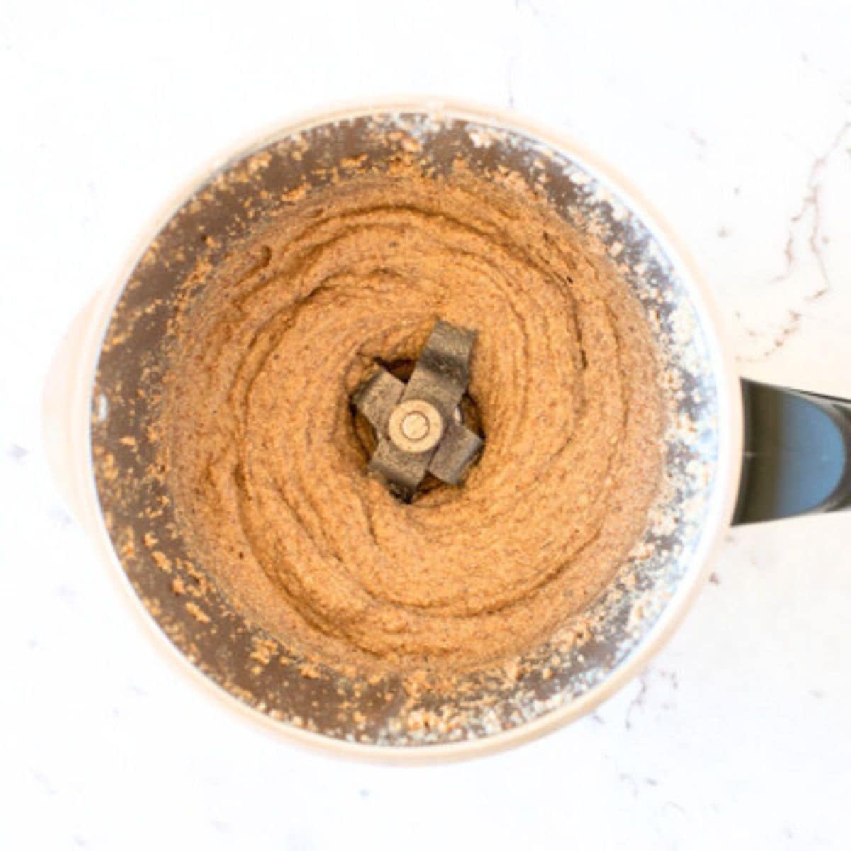 Almond butter in a Thermomix bowl.