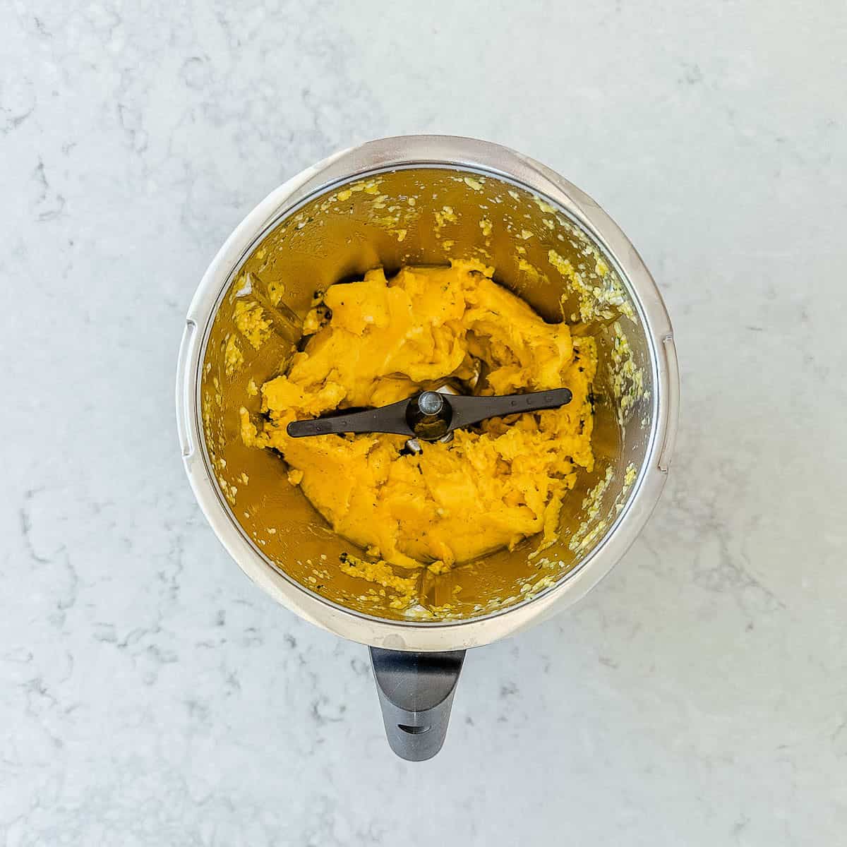 Mango sorbet in a Thermomix bowl.