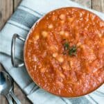 Homemade baked beans in a metal dish.