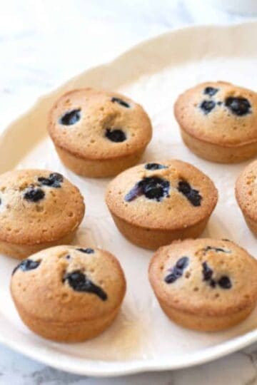 blueberry and almond friands on white dish