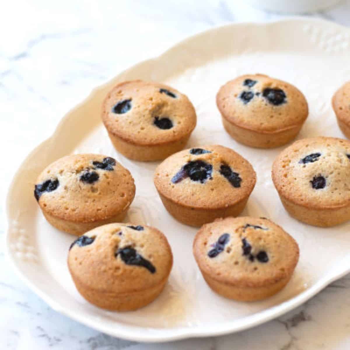 blueberry and almond friands on white dish