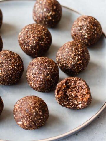 Date Bliss Balls on a round blue plate.