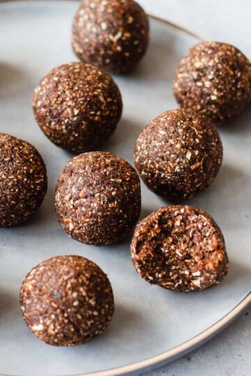 Date Bliss Balls on a round blue plate.