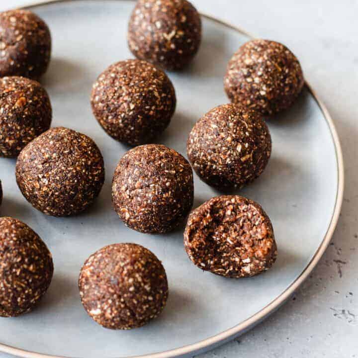 Date Bliss Balls on a round blue plate.