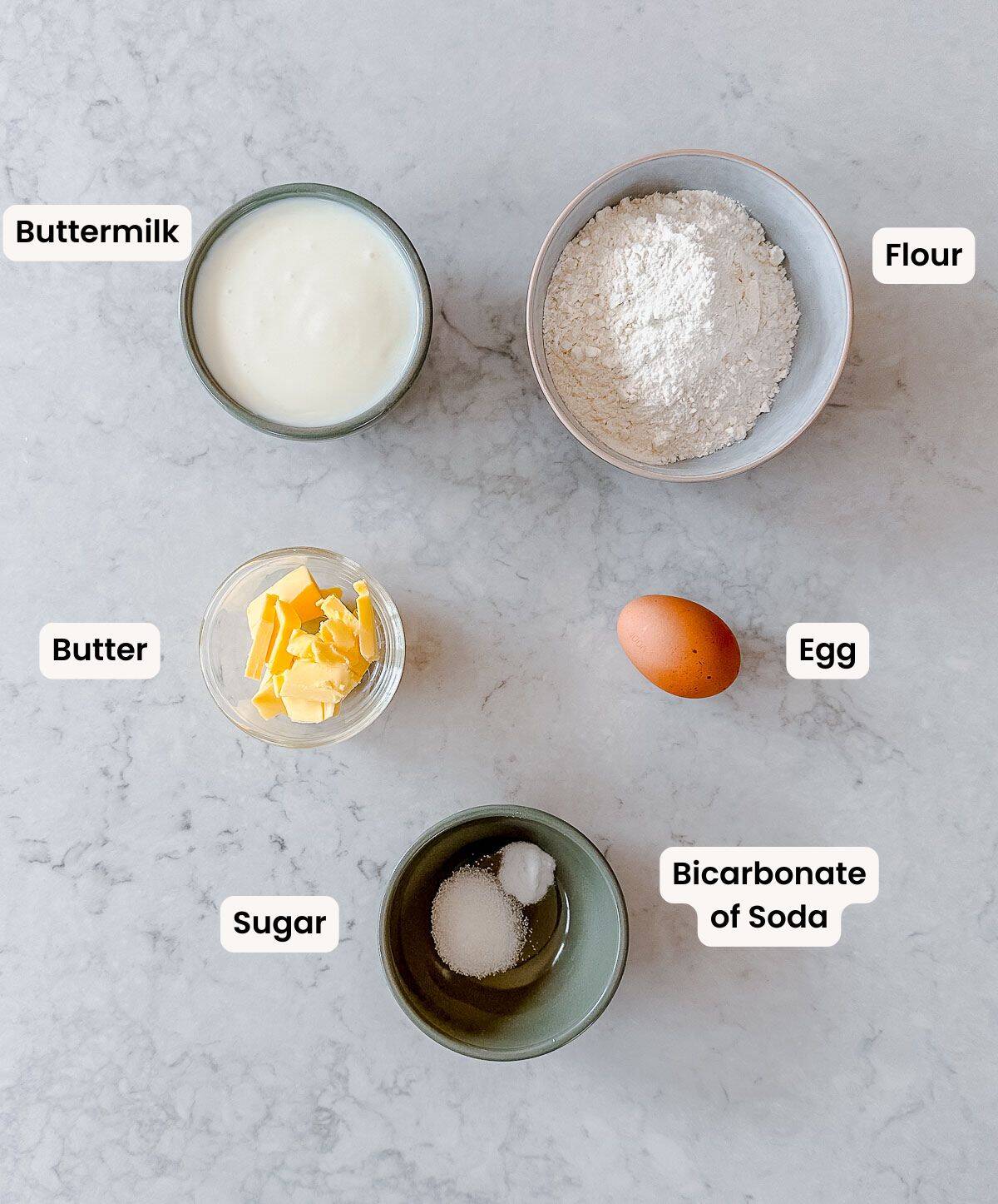 A collection of labelled ingredients to make buttermilk waffles.