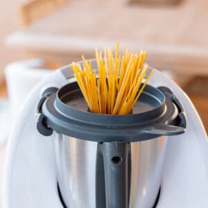 Spaghetti pasta being cooked in a Thermomix.