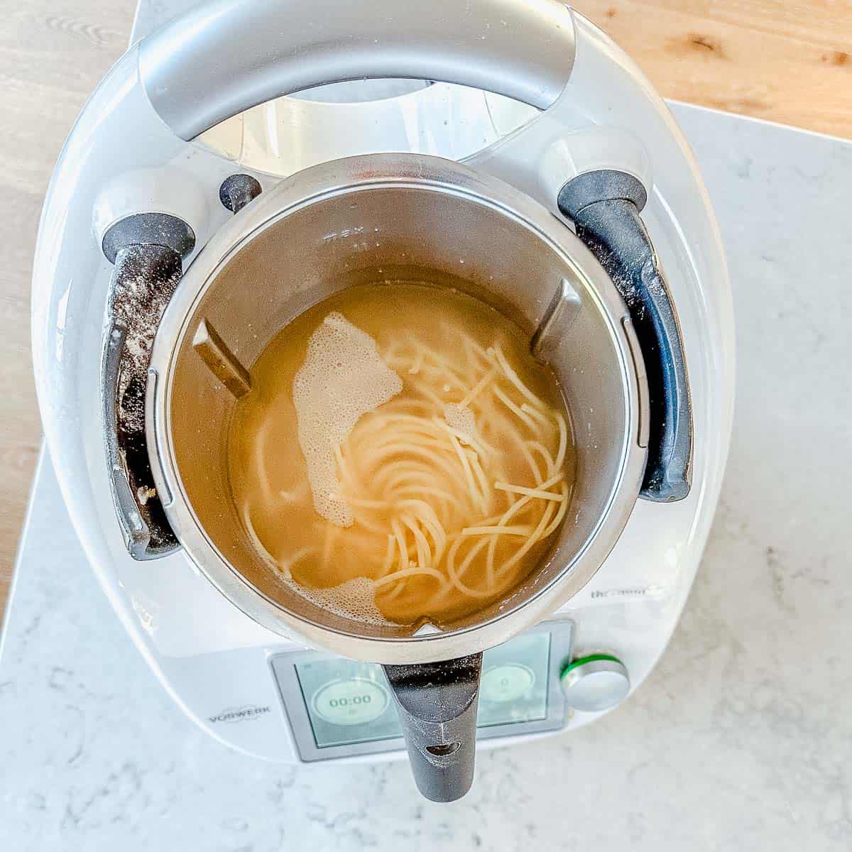 Spaghetti in a thermomix bowl.