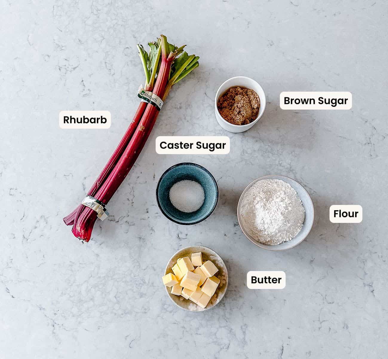 A collection of ingredients needed to make Rhubarb Crumble in the Thermomix.
