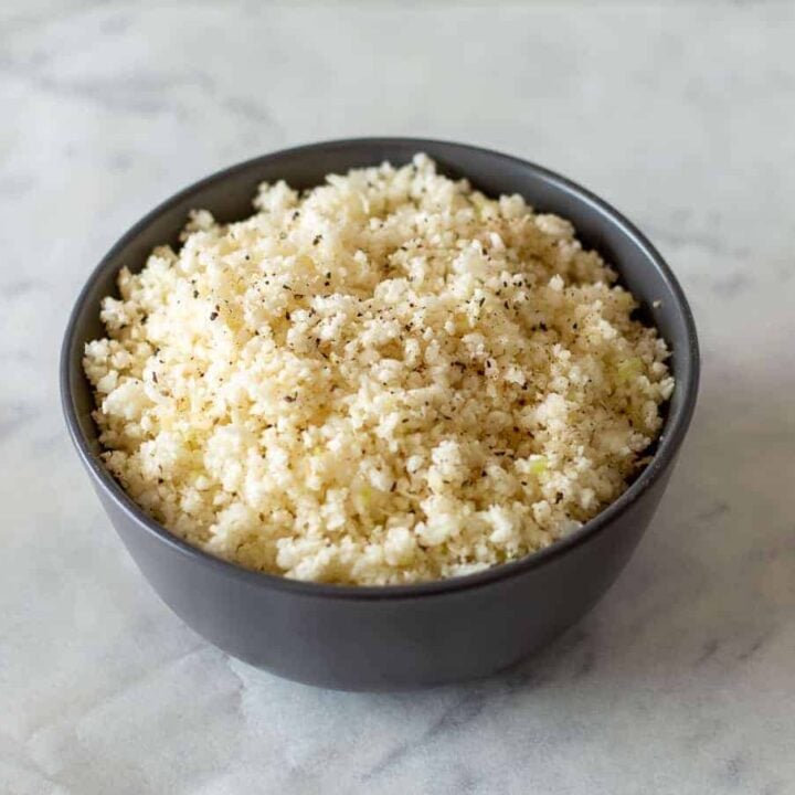 cauliflower rice in black bowl.