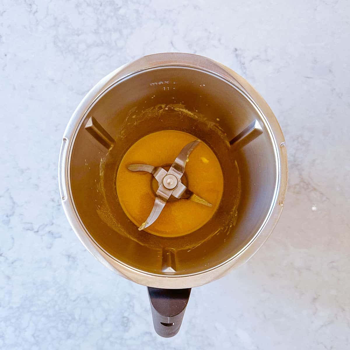 Melted butter in a Thermomix bowl.