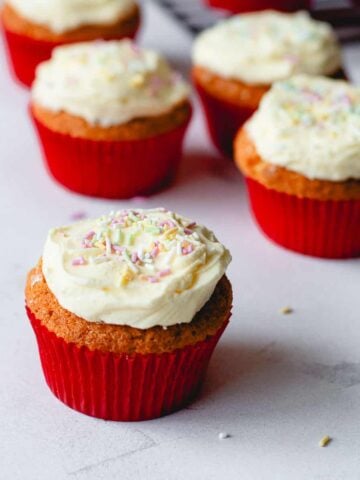 Cupcakes with buttercream icing and sprinkles.