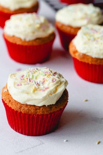 Cupcakes with buttercream icing and sprinkles.
