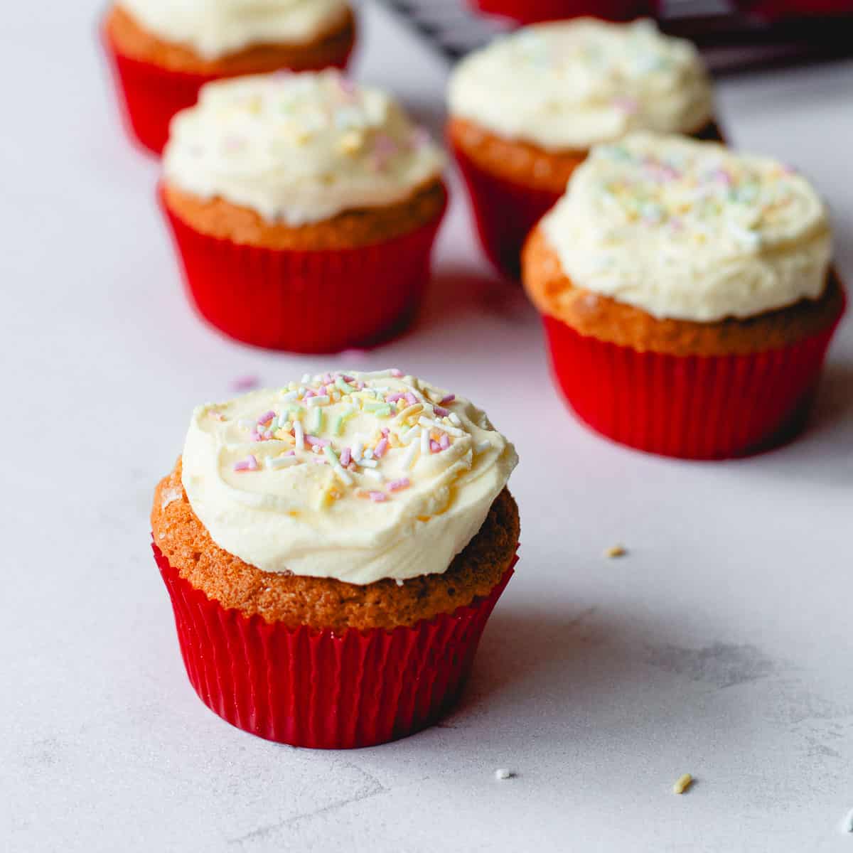 Cupcakes with buttercream icing and sprinkles.