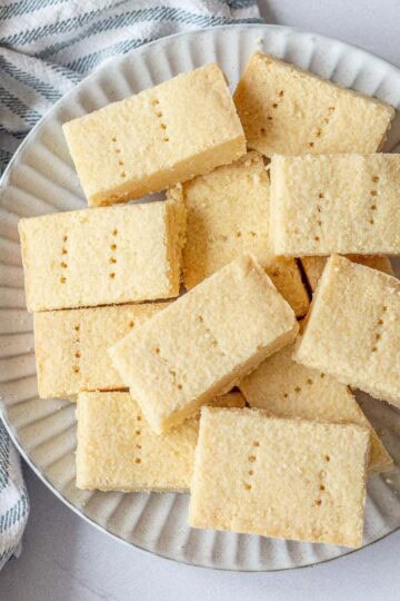 A plate of shortbread rectangles on a light coloured background.