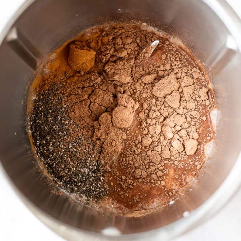 Chocolate chia pudding ingredients in a thermo bowl.