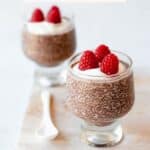 Chocolate Chia Seed Pudding on a board with a spoon.