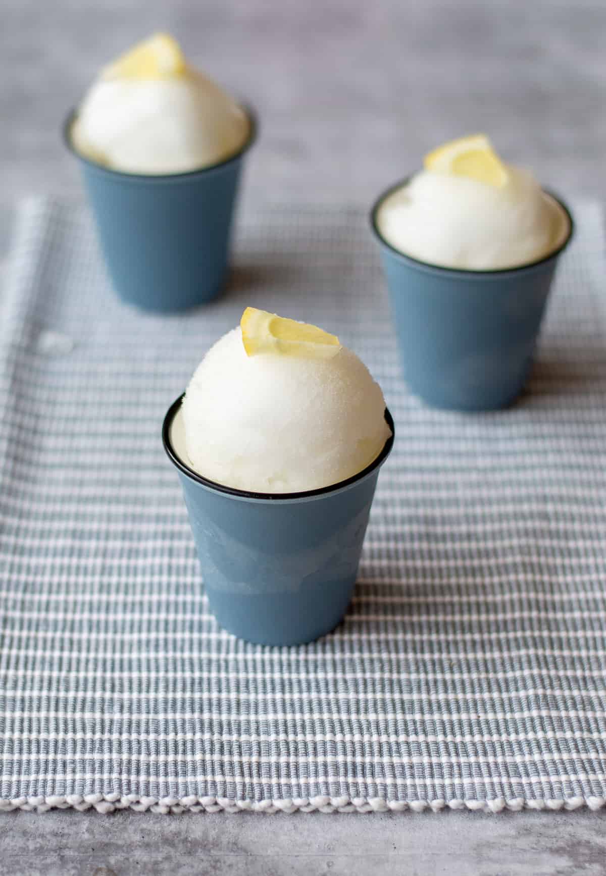 Three Gin and Tonic Sorbets garnished with lemon wedges
