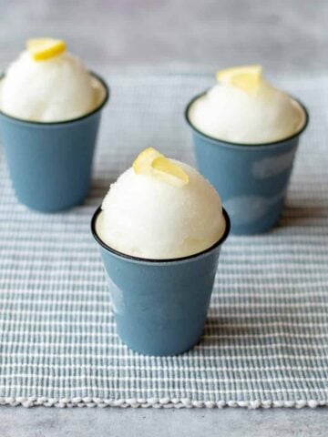 3 gin and tonic sorbets garnished with lemon wedges