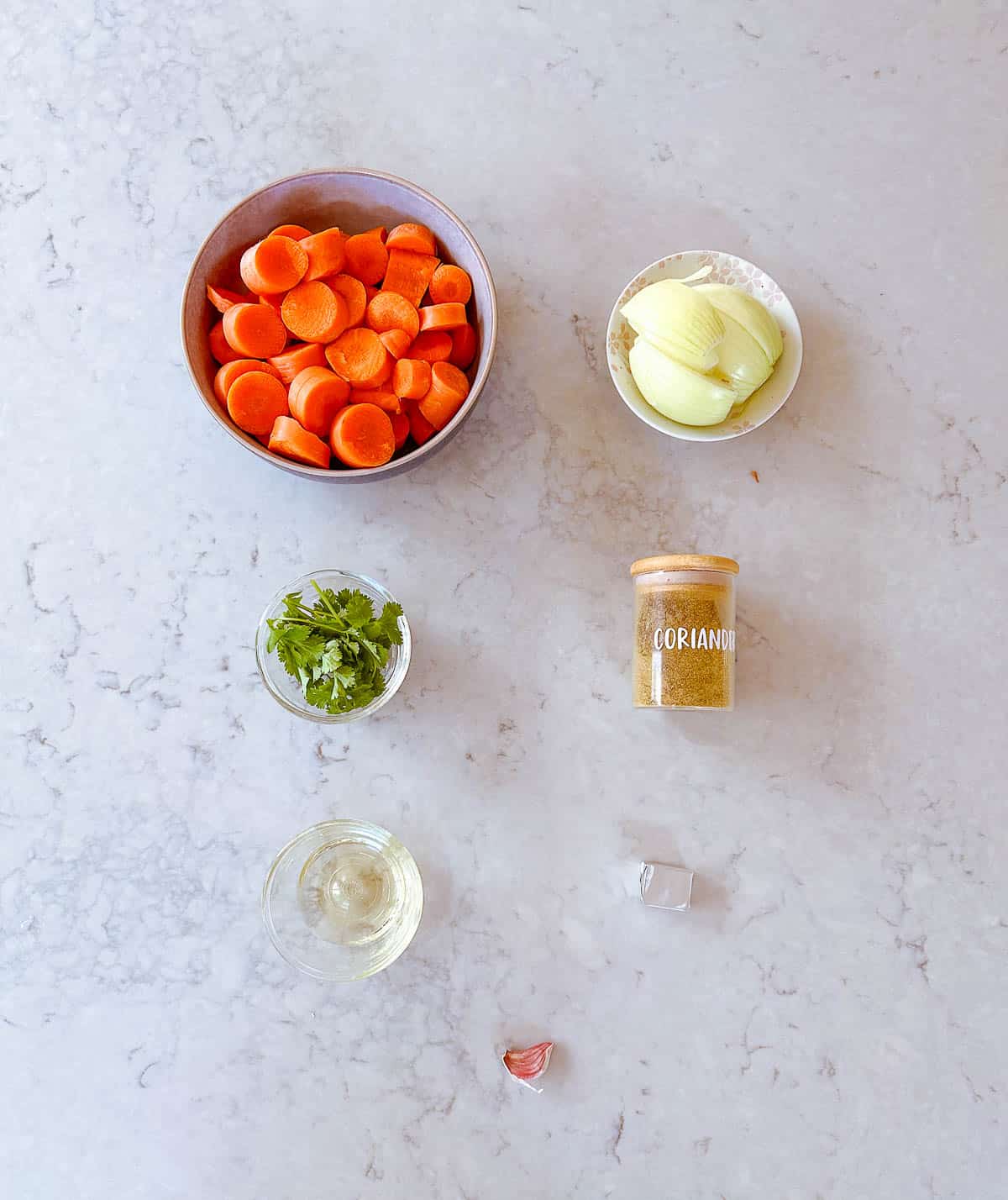 A collection of ingredients used to make Carrot and Coriander Soup.
