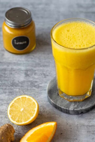 A citrus, ginger and turmeric juice made in the Thermomix.