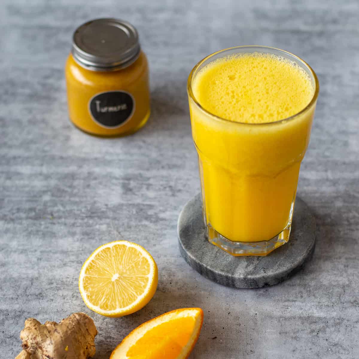A citrus, ginger and turmeric juice made in the Thermomix.