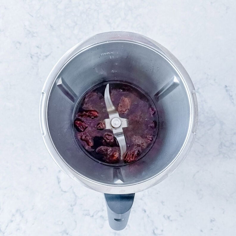 Dates soaking in hot water in a Thermomix bowl to make them soft.