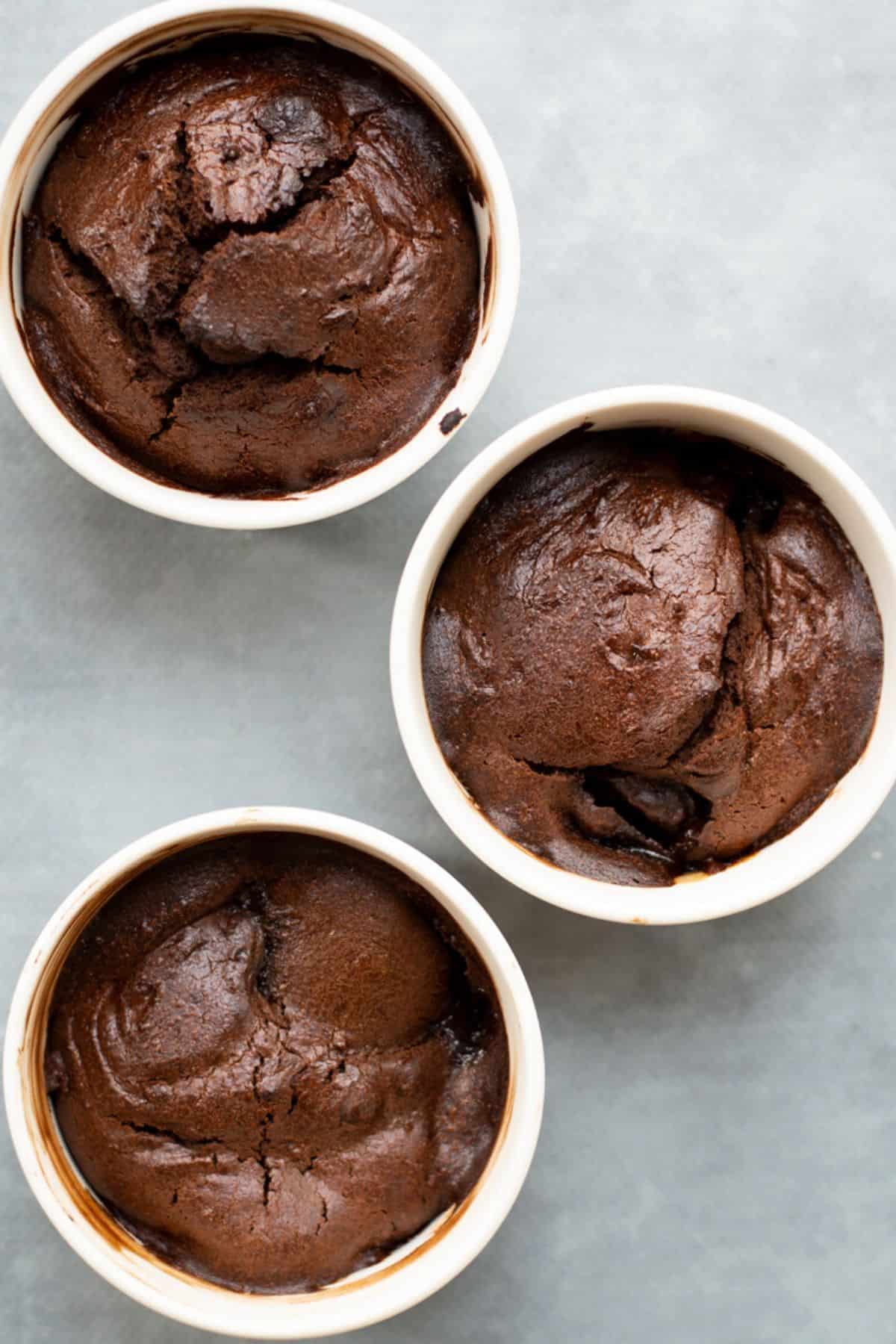 Overhead close up of Chocolate Pear Pudding in 3 white ramekins