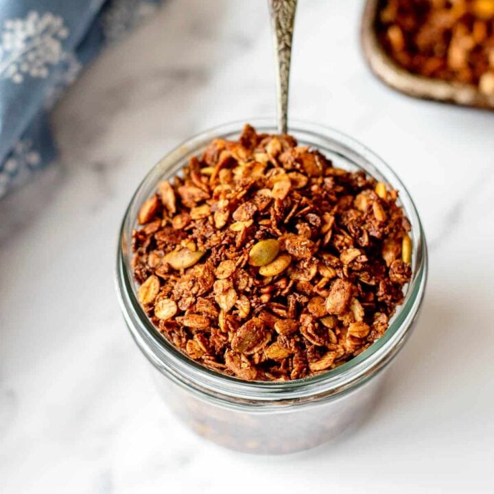 Homemade Chocolate Granola in a glass jar.