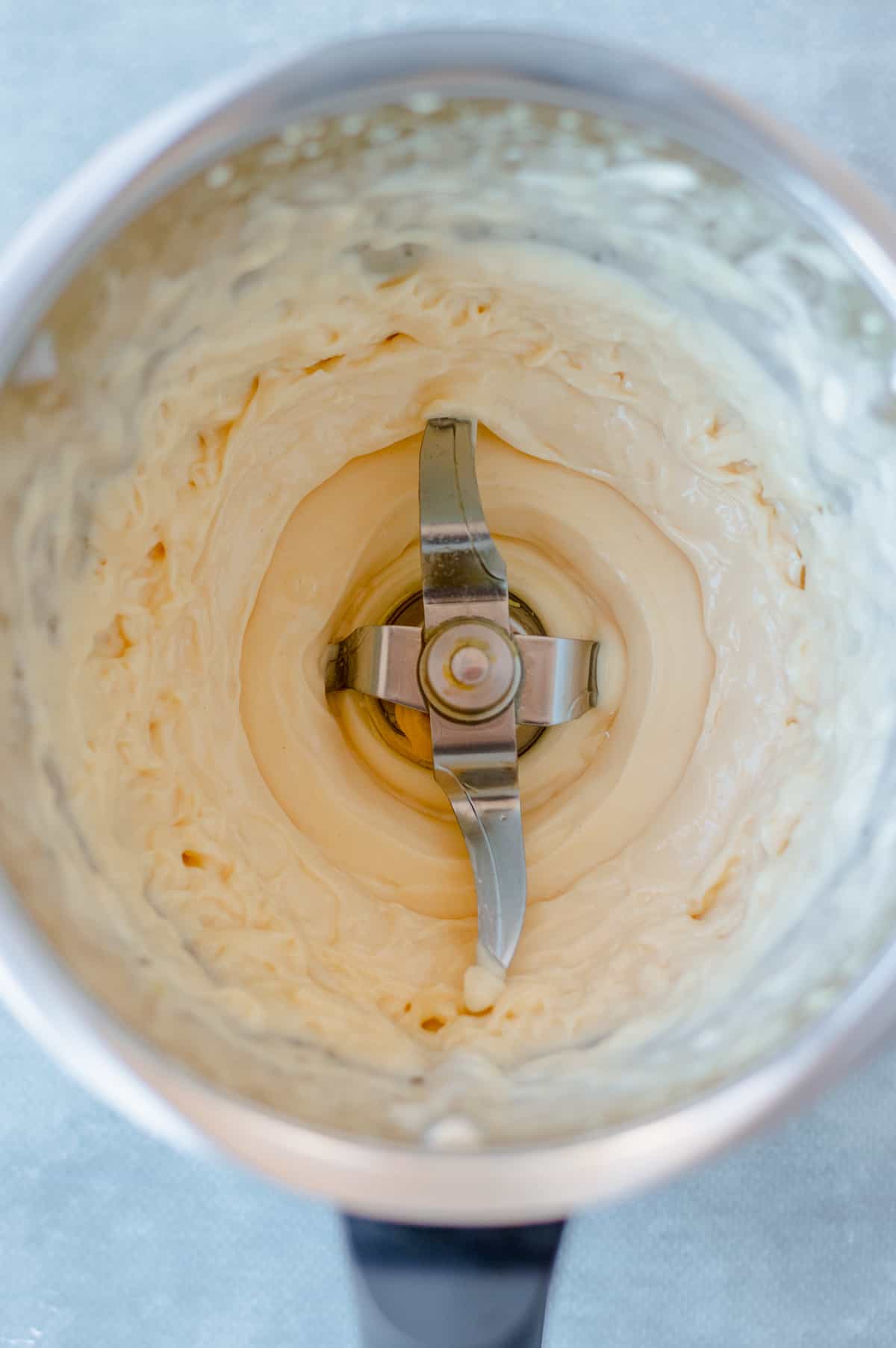 Mayonnaise being made in the Thermomix bowl.