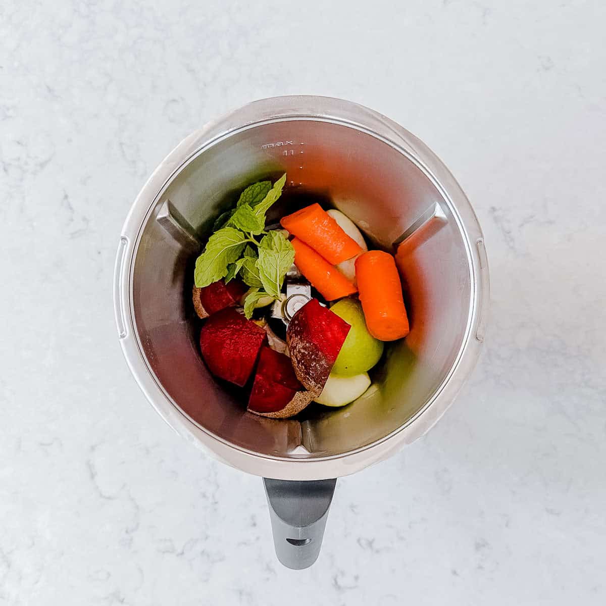 Beetroot salad ingredients in a Thermomix bowl.