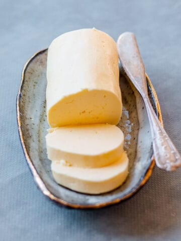 Homemade Butter on a dish with knife.
