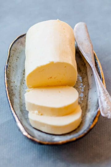 Homemade Butter on a dish with knife.