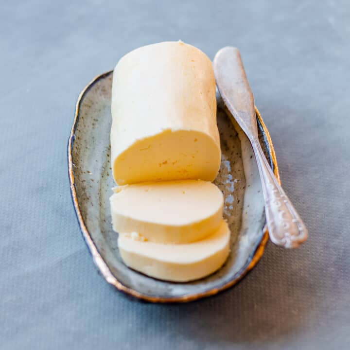Homemade Butter on a dish with knife.