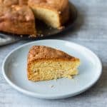 A slice of Homemade Apple Cake on a Blue Plate