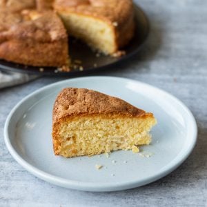 A slice of Homemade Apple Cake on a Blue Plate
