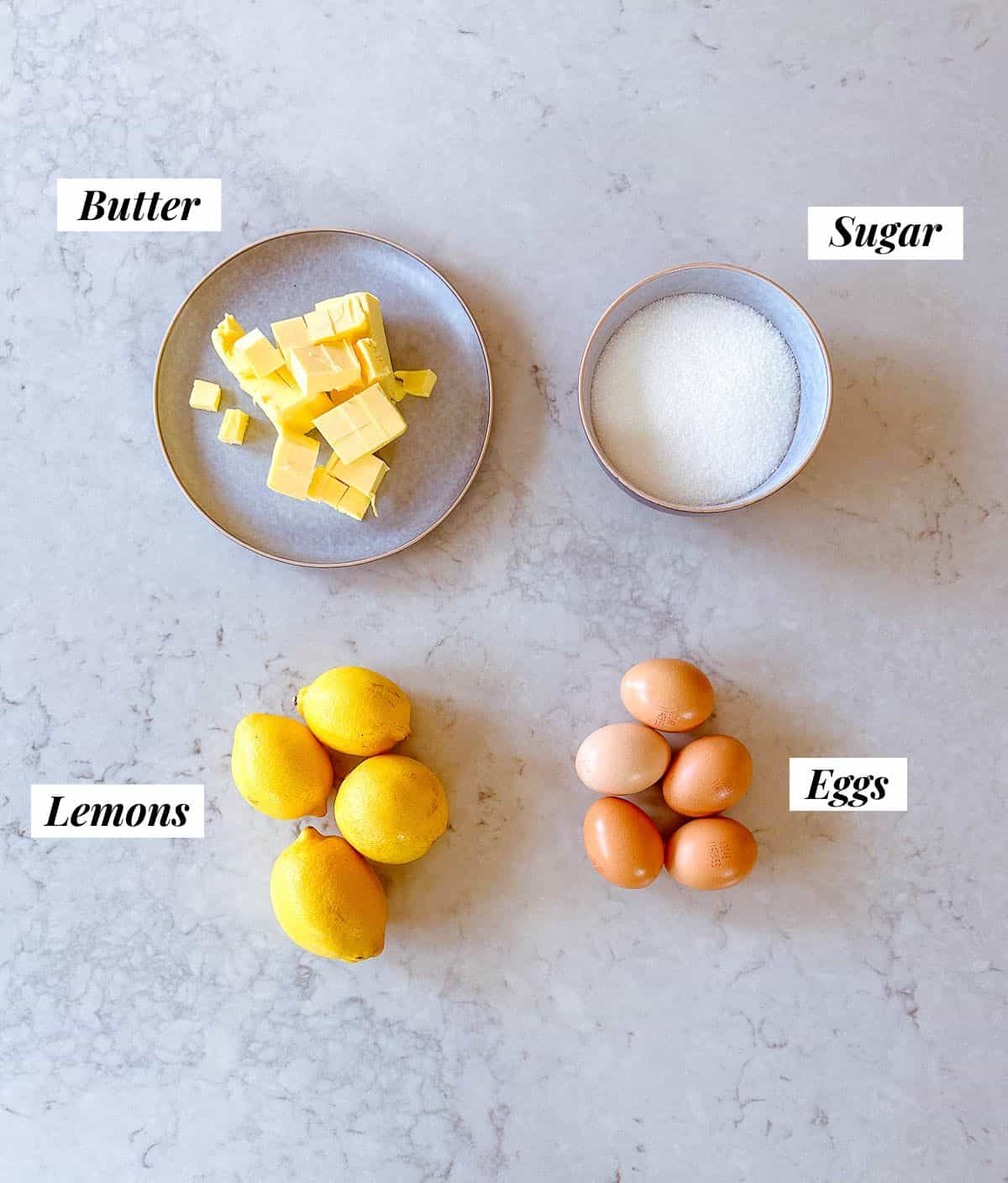 lemons, butter, eggs and sugar ingredients to make lemon curd.