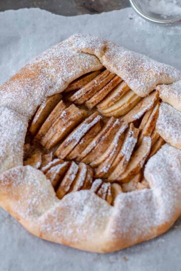 Apple Galette on baking paper waiting to be sliced