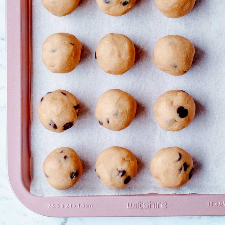 Cookie dough balls on baking sheet