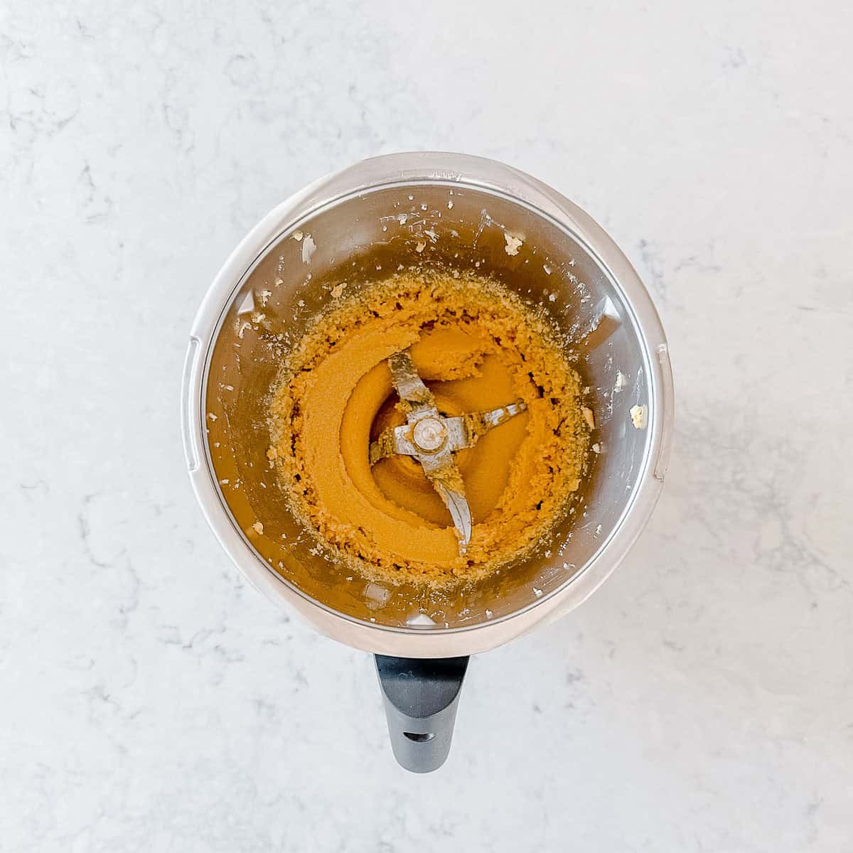 Butter and sugar creamed together in a Thermomix bowl.
