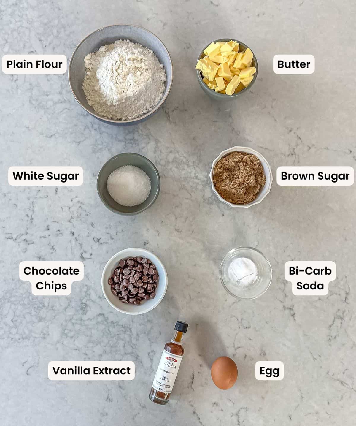 A collection of ingredients needed to make Chocolate Chip Cookies.