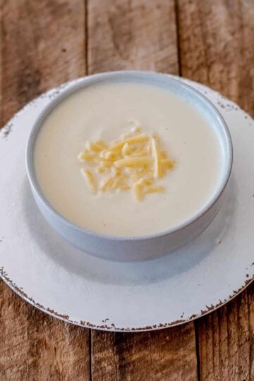 Thermomix Cheesy Cauliflower Soup in a white bowl