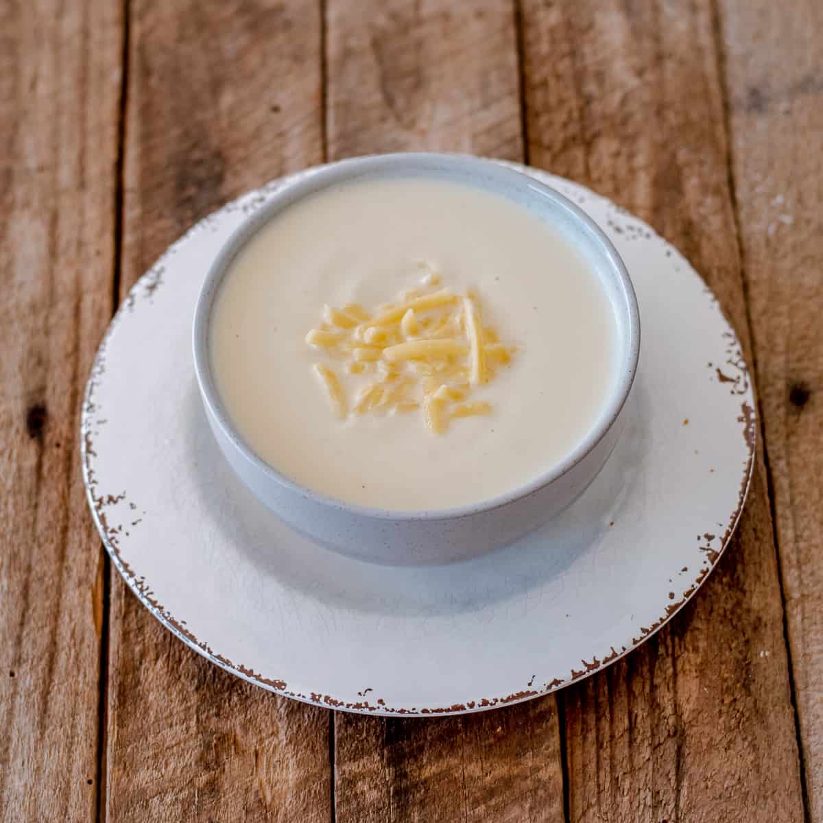 Thermomix Cheesy Cauliflower Soup in a white bowl