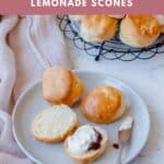 Lemonade Scones with Cream and Jam on a grey plate