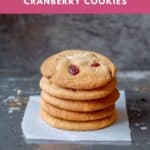 5 white chocolate and cranberry cookies stacked on top of one another