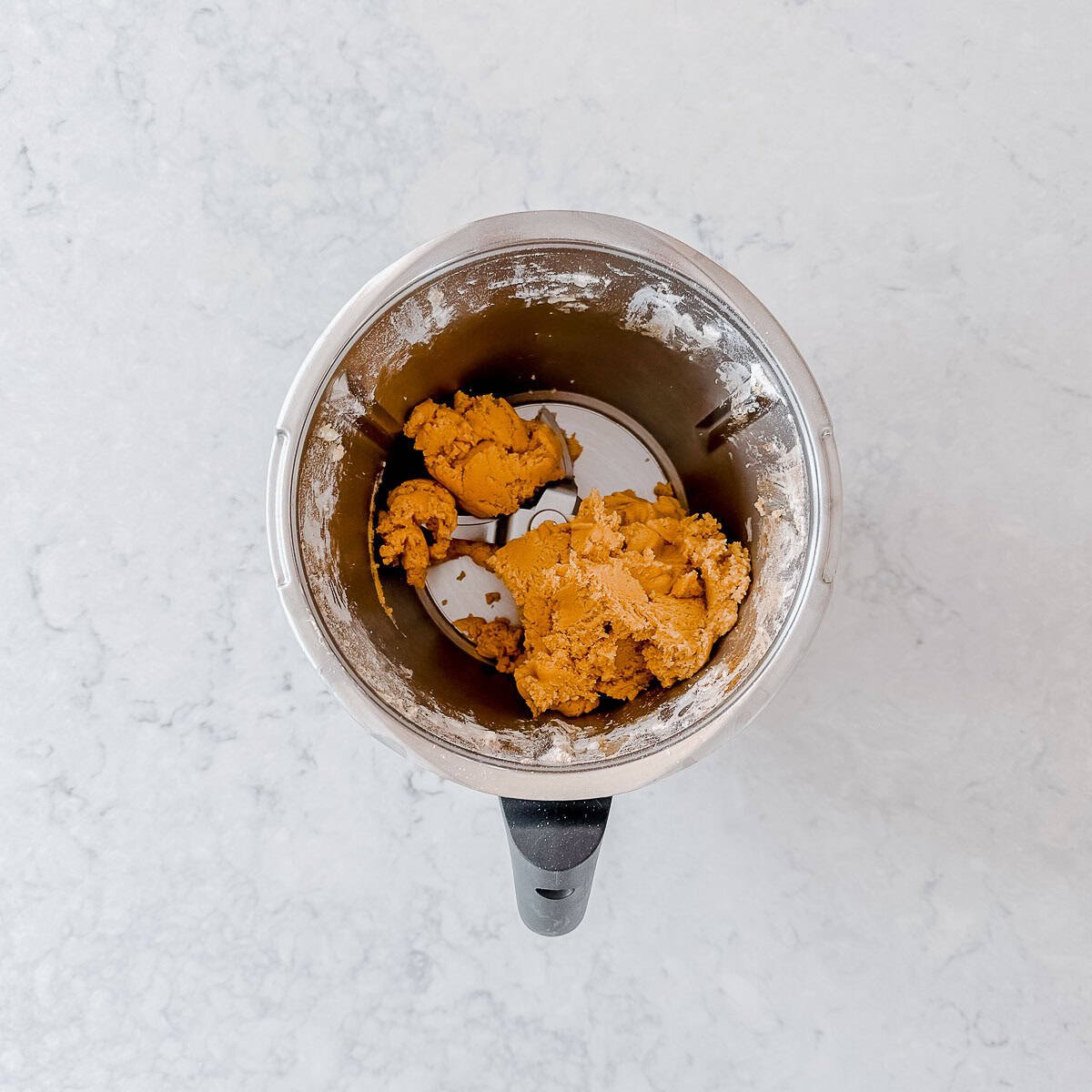 Gingerbread dough in a Thermomix bowl.