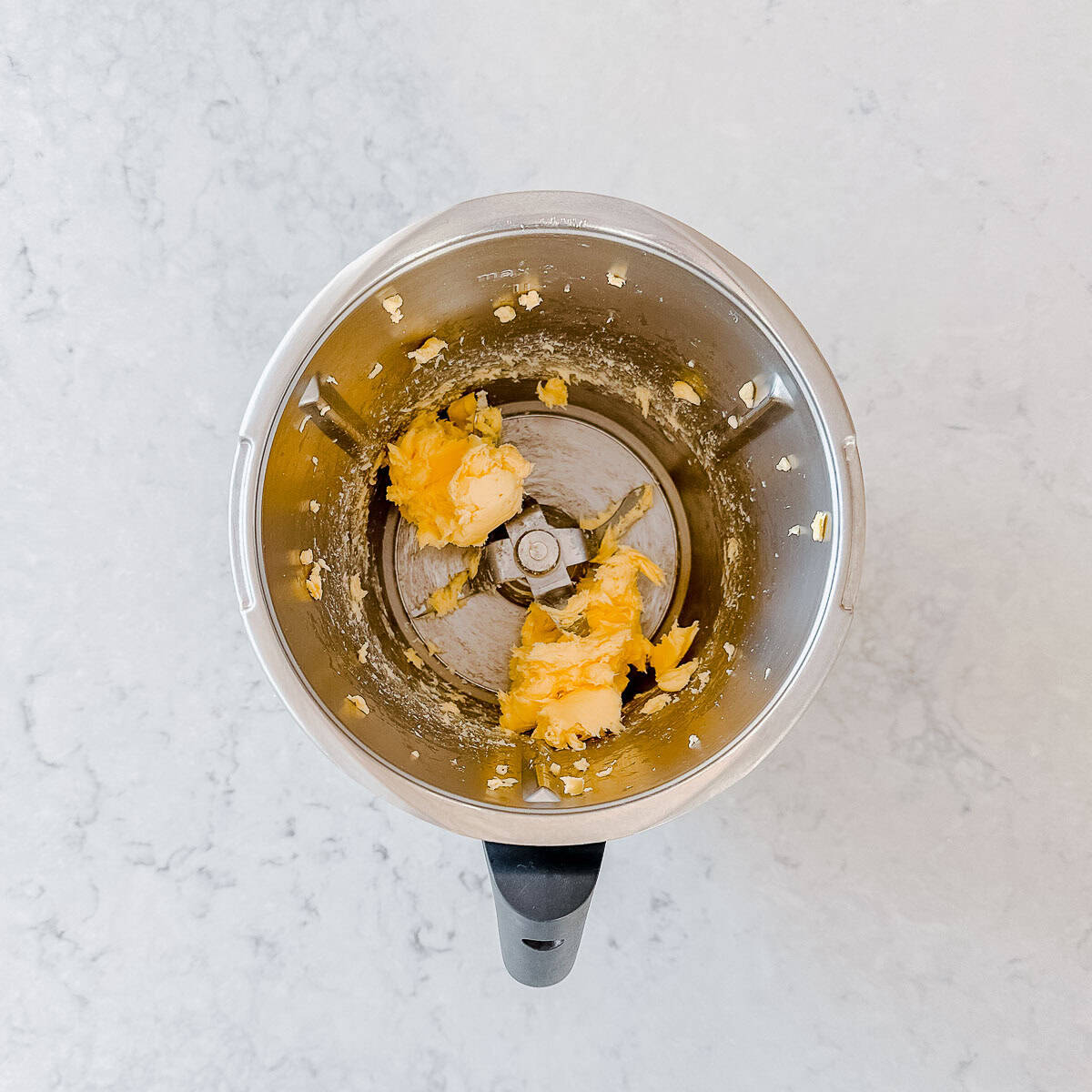 Softened butter in a Thermomix bowl.